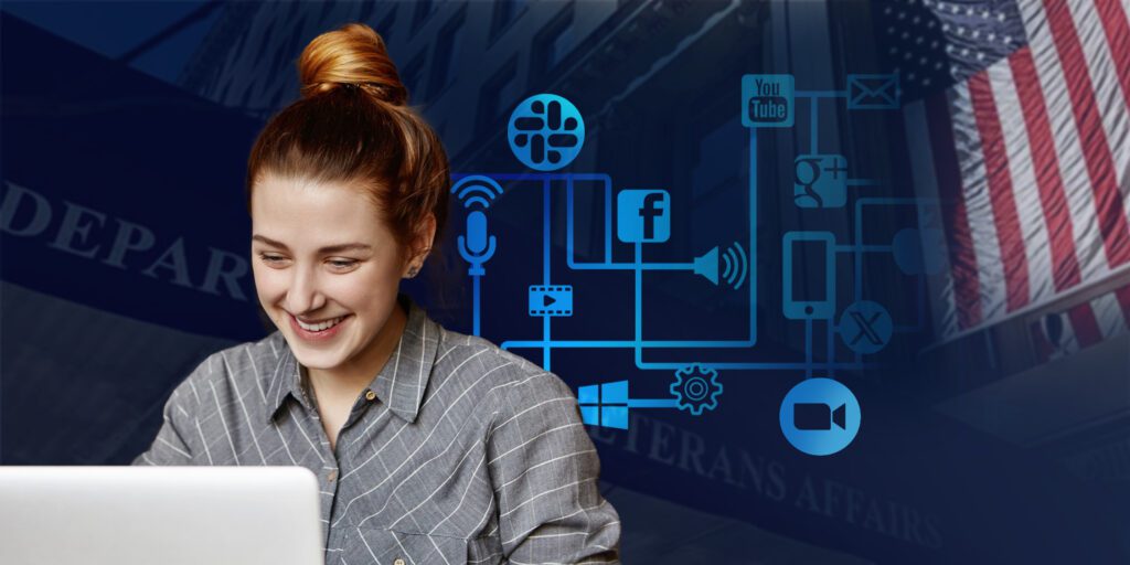 woman typing and smiling in front of the laptop